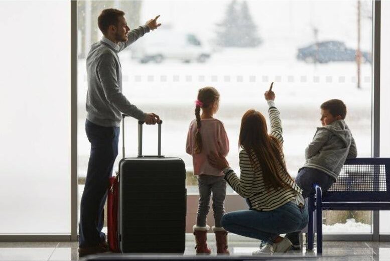 A family at the airport waiting for their departure. Protect your home before you travel with Munn Insurance.